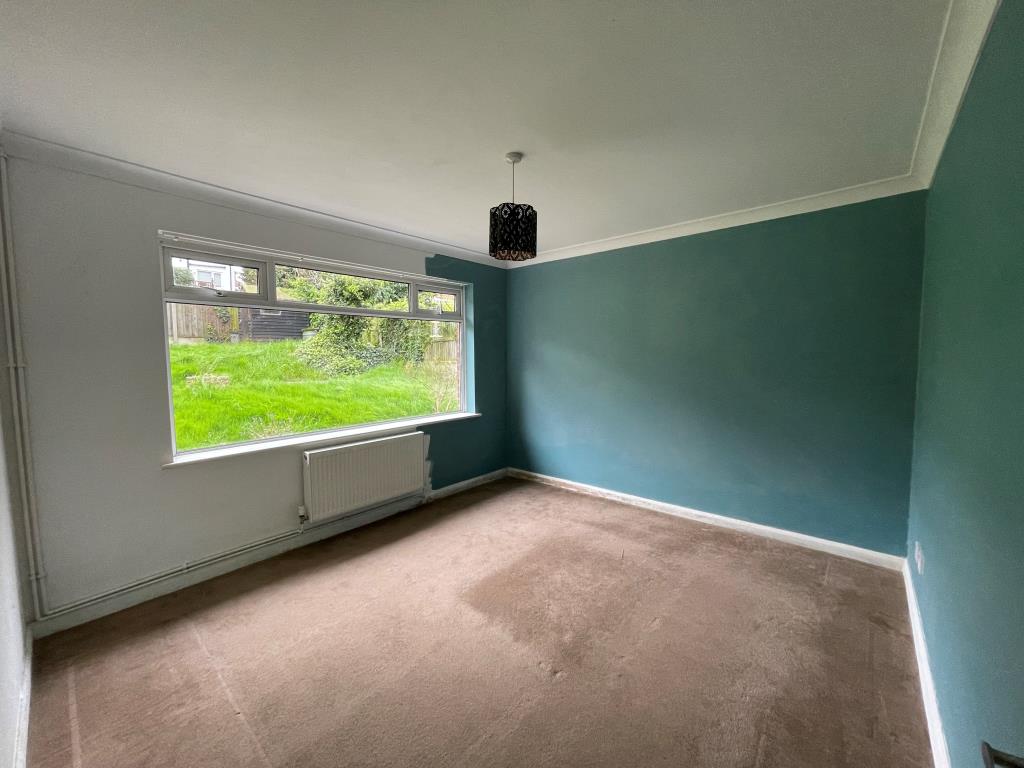 Lot: 106 - DETACHED BUNGALOW FOR IMPROVEMENT - Bedroom one with view to garden